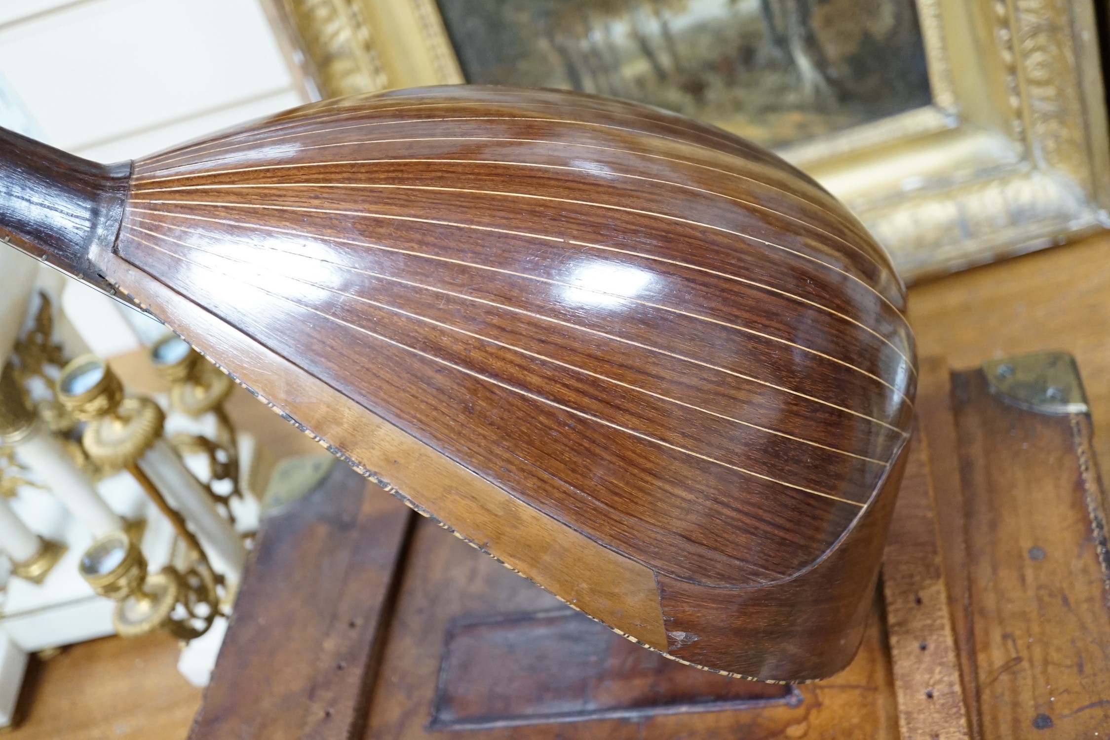 A late 19th century German violin together with an Italian mandolin, (both cased)